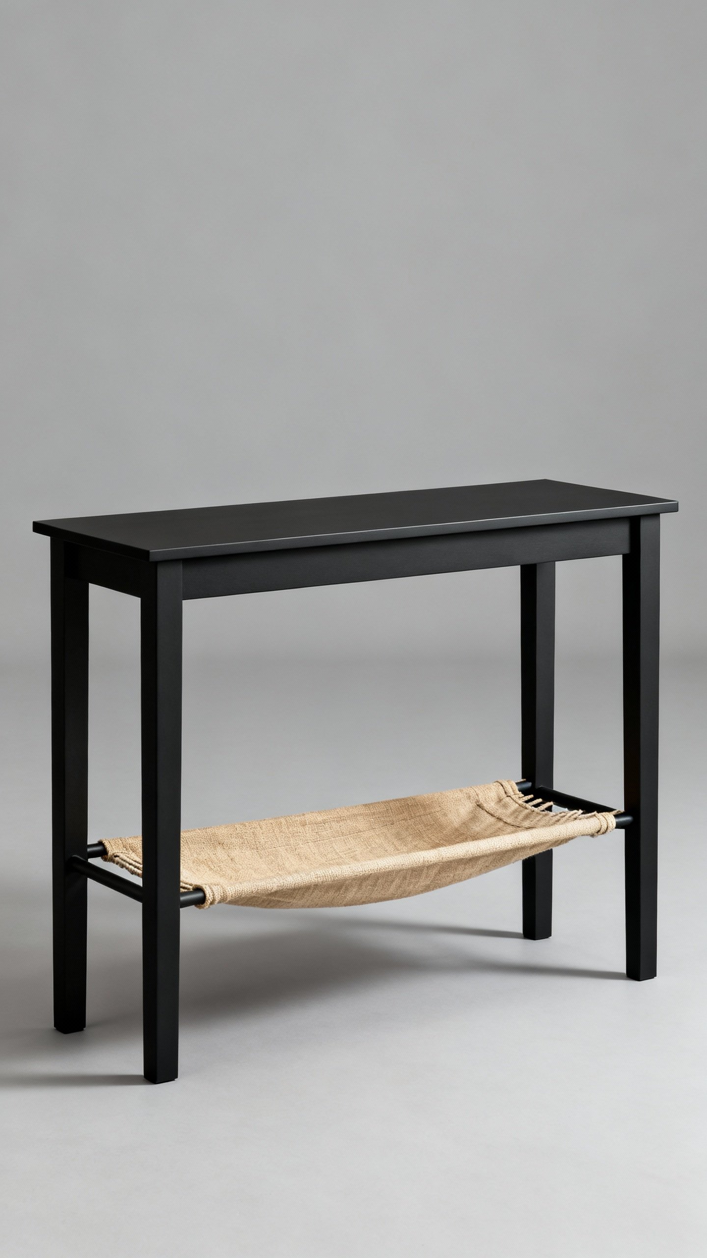 Slim matte black console with under-shelf canvas hammock